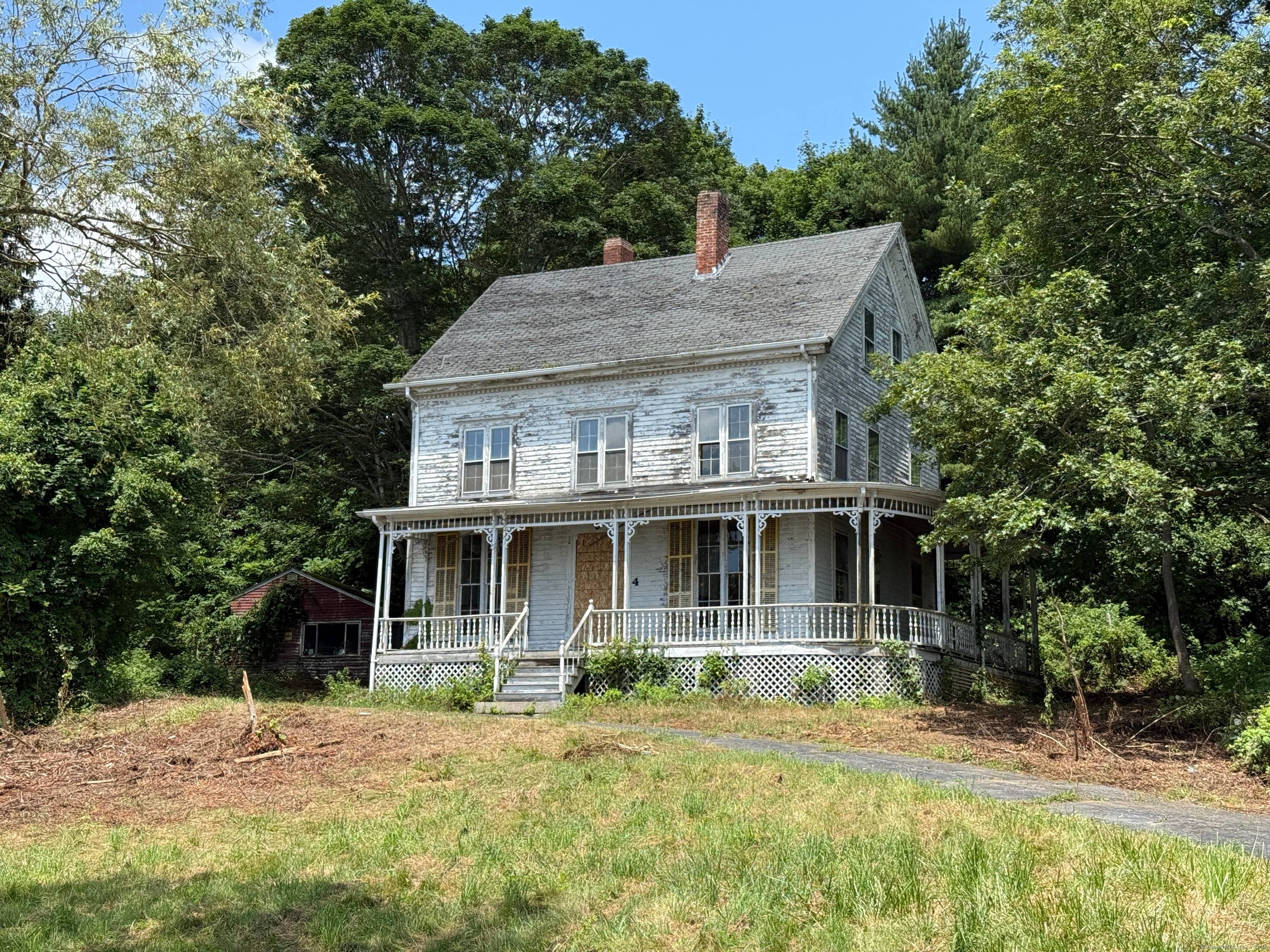 Stunning 1857 historic Victorian era home on a hilltop overlooking the Mystic River and the Mystic Seaport beyond.