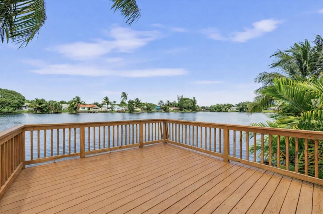 Welcome to this beautiful lakefront home in Palm Aire Village.