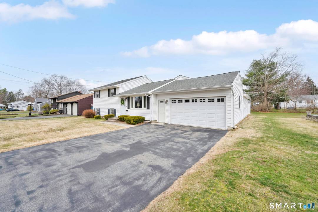 Rev up your engines, this 3 bedroom split level home in East Wallingford is a dream come true !