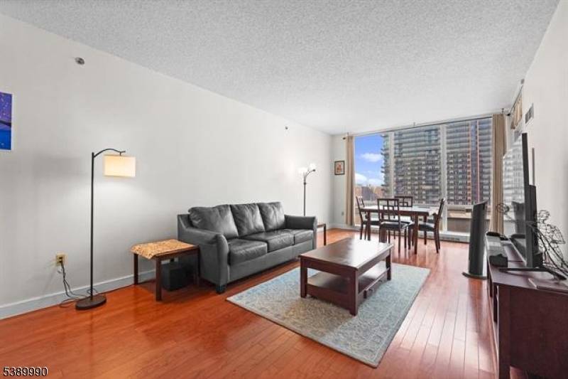 One Bedroom Condo with Private Balcony Luxe Amenities Prime Jersey City Location.
