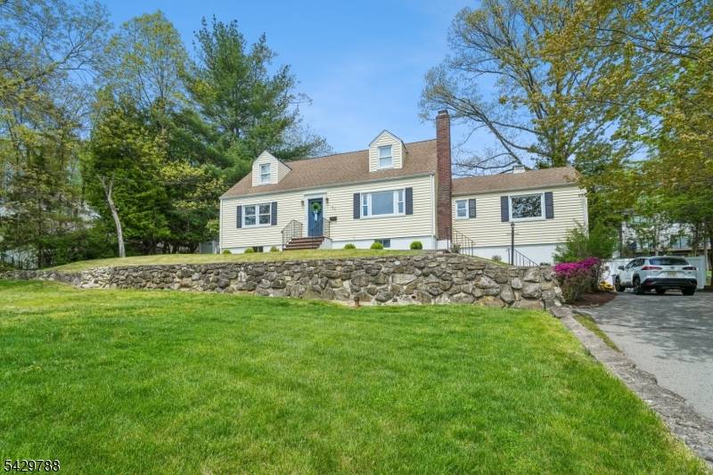 Set on a quiet, tree lined street in the heart of Morris Plains, this beautifully renovated 4 bedroom, 2.