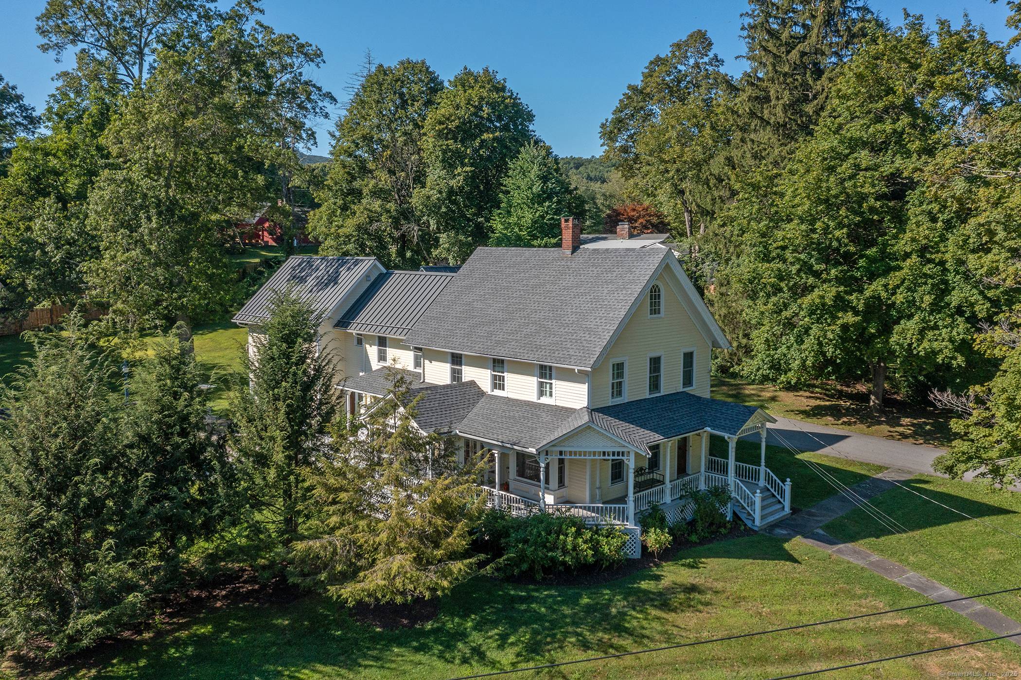 This beautiful Queen Anne Victorian sits prominently above the village of Lakeville on just over an acre.