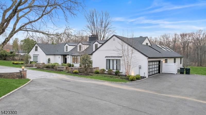 Welcome to 16 E Greenbrook Road situated on a pristine 2.