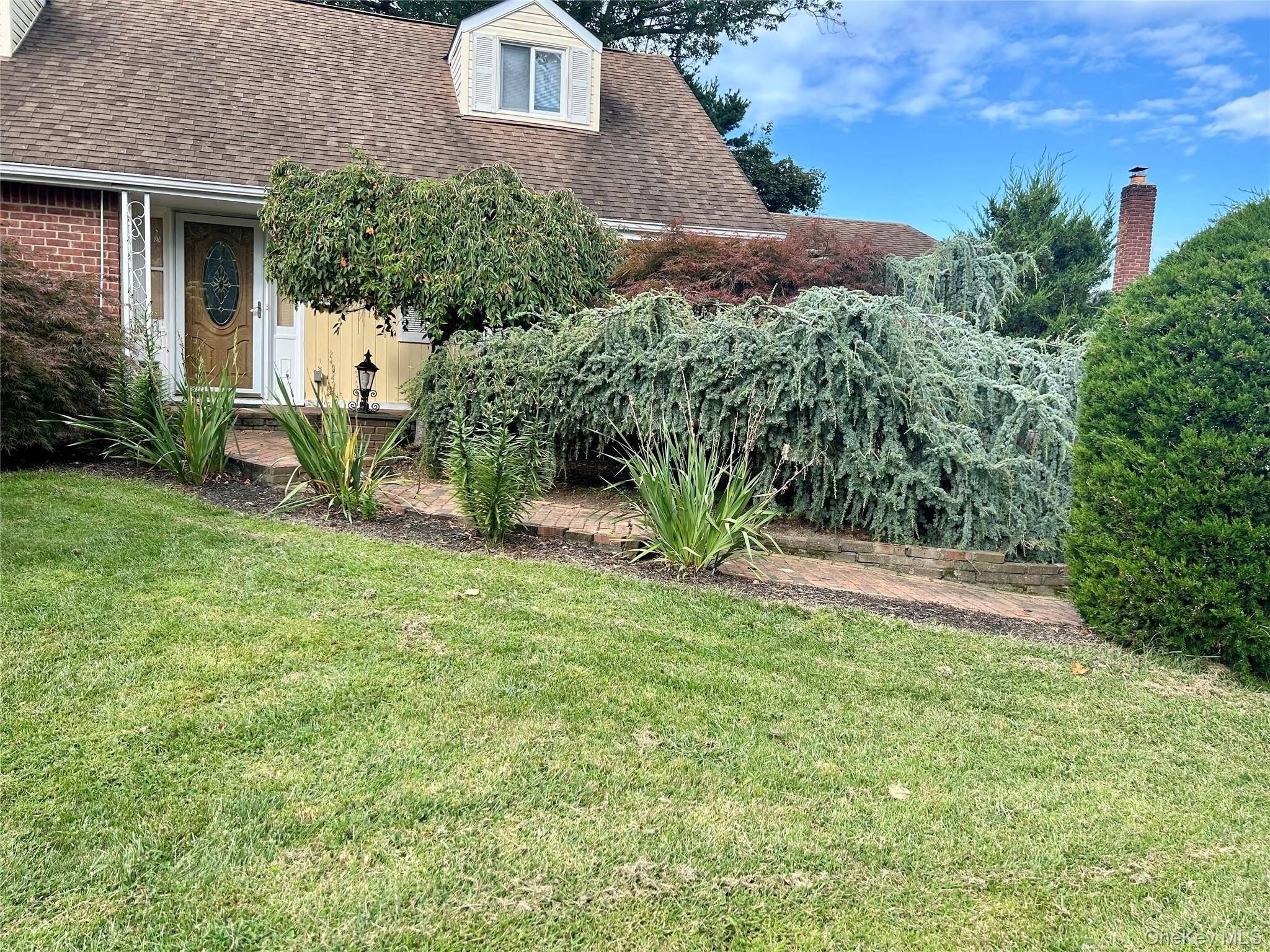 Charming and cozy 4 bedroom, 2 bath Cape located in the heart of East Northport.