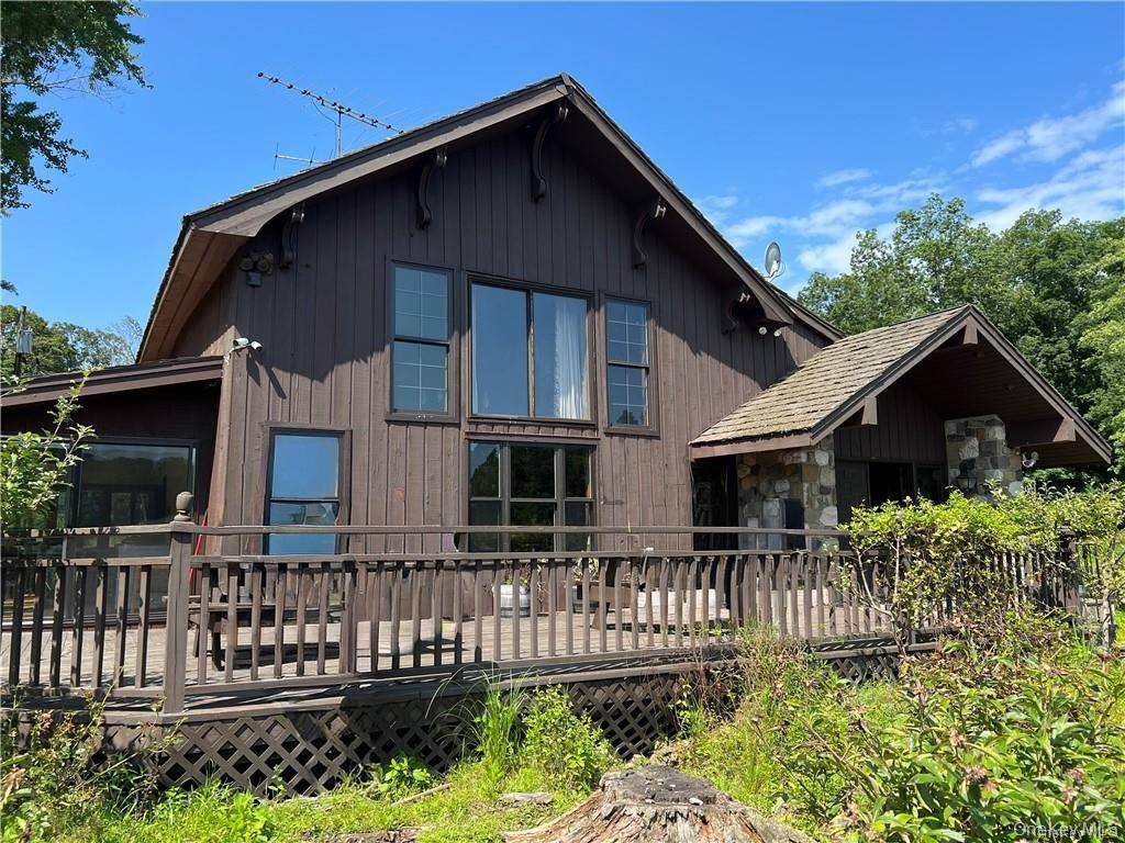 Discover the allure of 89 sprawling acres in Orange County, New York, featuring a charming farm house and a tranquil pond.