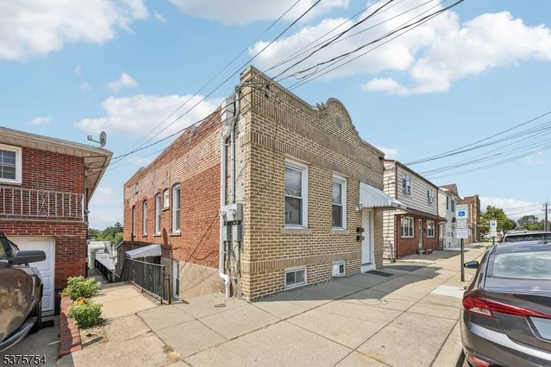 Great 2 family home featuring a 4 bedroom unit with a kitchen, dining room, living room, 2 full bathrooms, and central air.