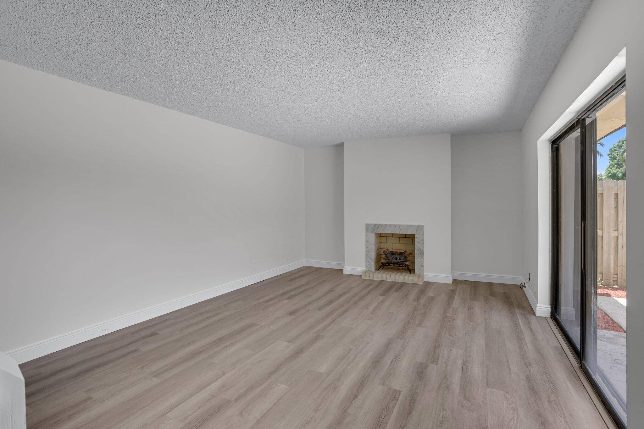 Step into this beautifully 2 bedroom, 2 bathroom townhouse featuring fresh interior paint, brand new flooring throughout, and sleek quartz countertops in both the kitchen and upstairs bathroom.