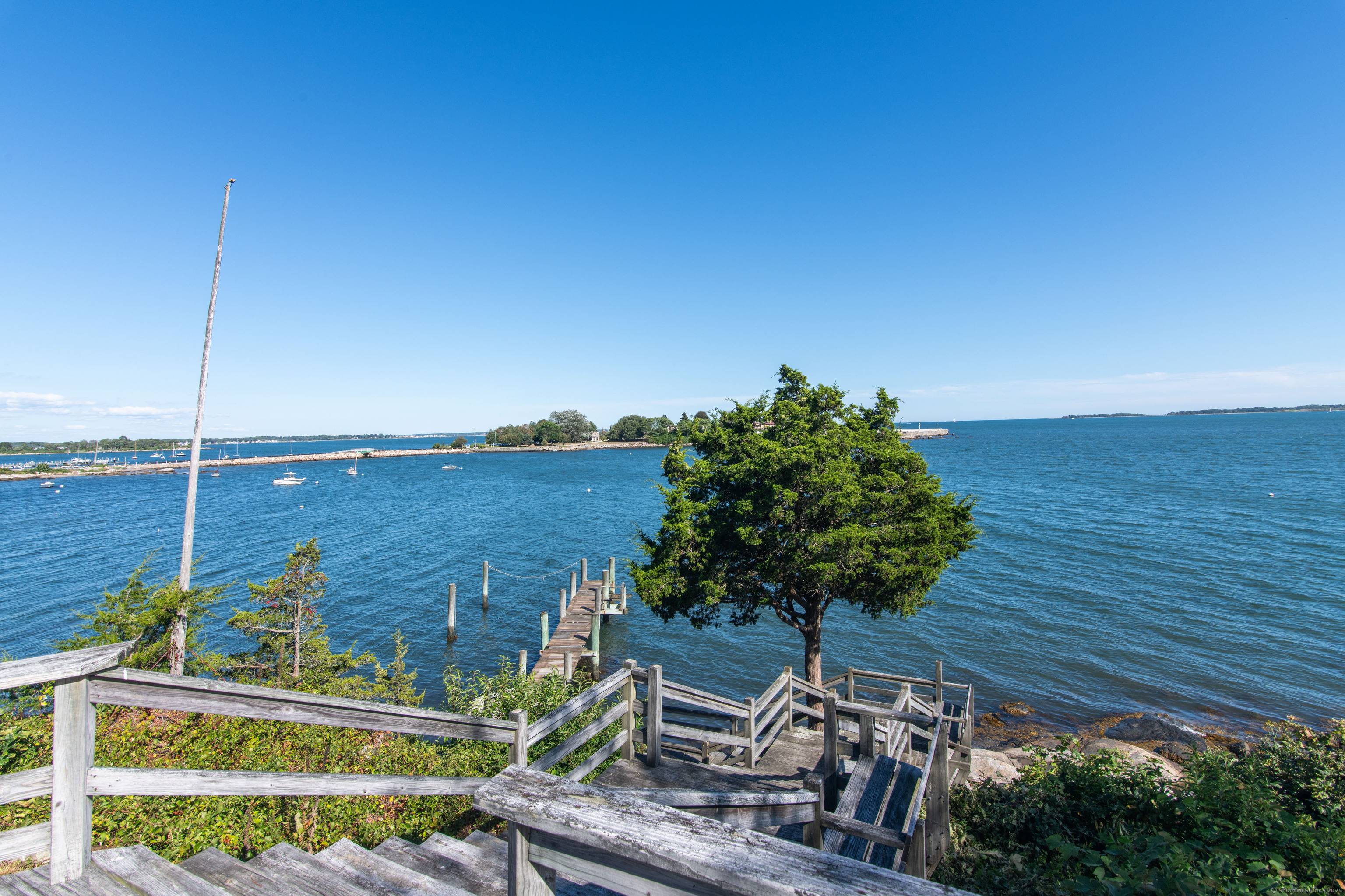 Magnificent Direct Waterfront with Unobstructed Water views and Private Deep Water Dock.