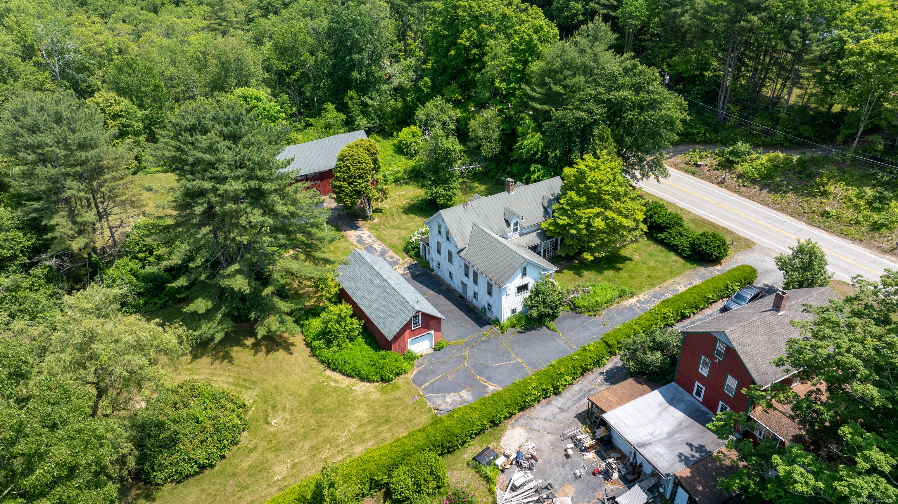 Welcome to 94 Mansfield Road in beautiful Ashford, Connecticut a property that perfectly blends natural charm with endless potential.
