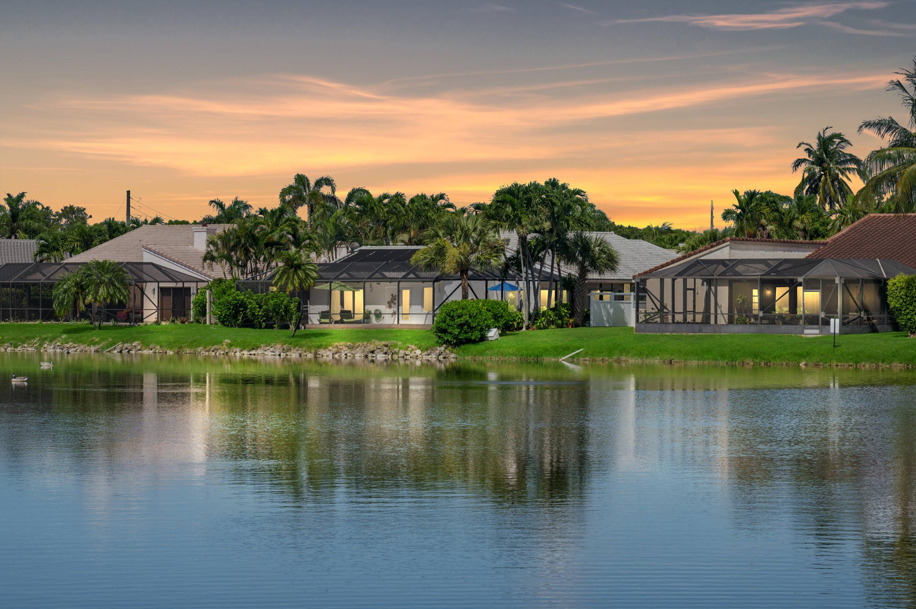 Stunning Lakefront views with an East exposure from one of few gated communities in EAST BOCA !