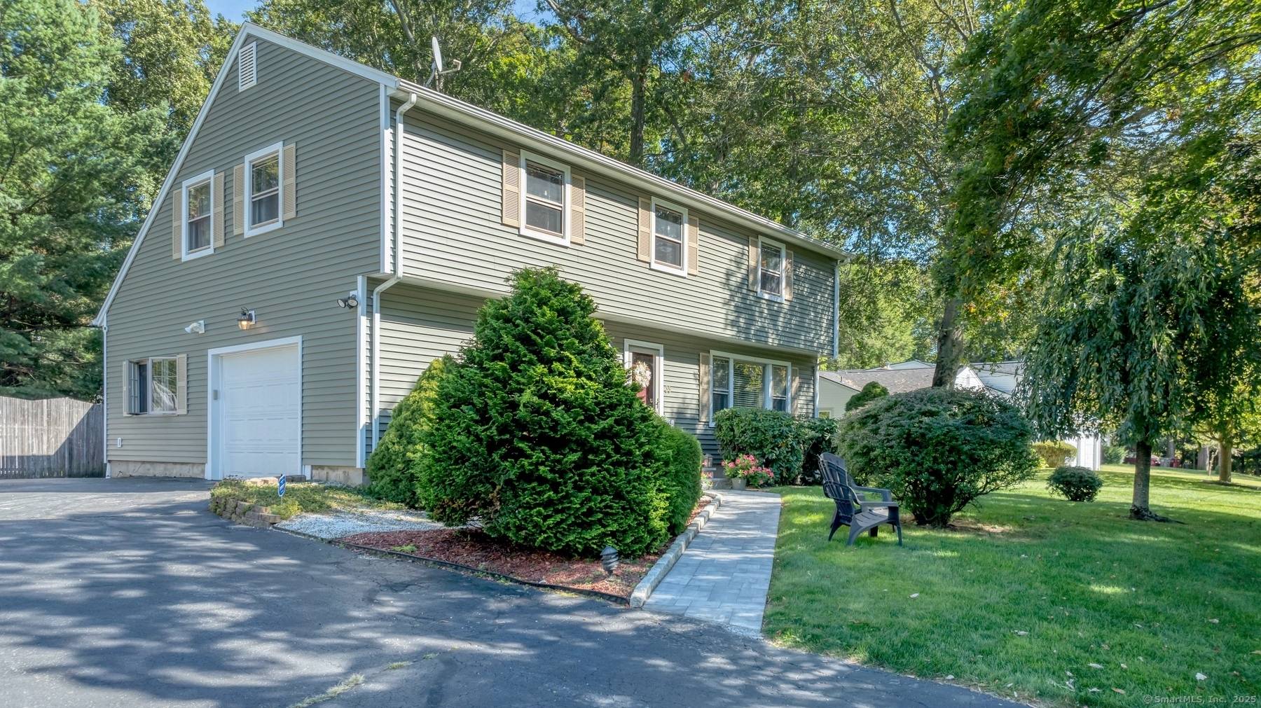 Nestled on a half acre of parklike grounds, this home is destined to impress !