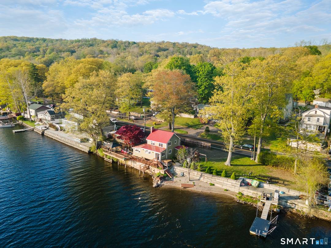 Live like you're on vacation every day in this stunning DIRECT WATERFRONT home on the beautiful Housatonic River !
