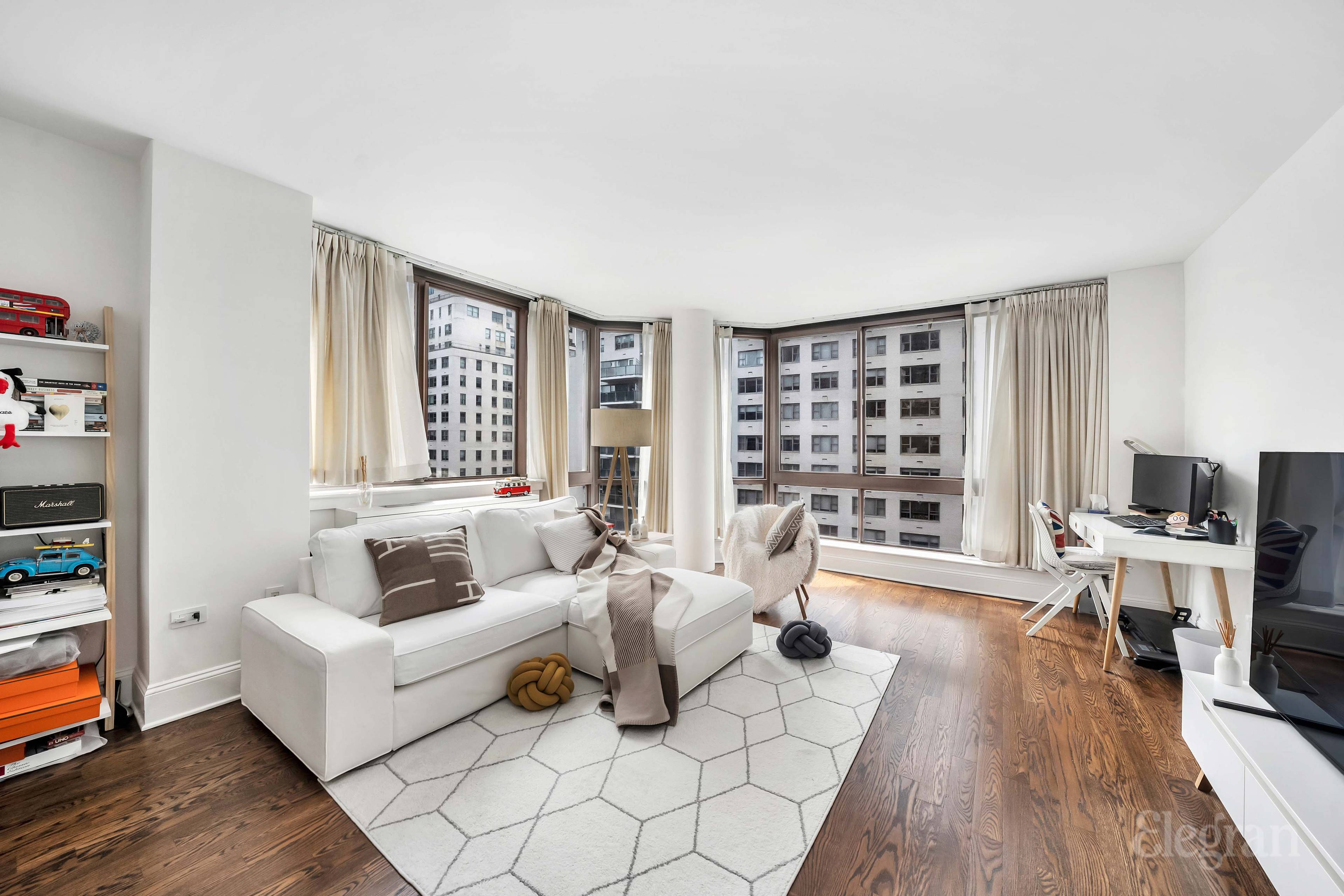 Highly coveted corner One bedroom boasting a wall of six oversized floor to ceiling windows with west and north light and open exposures in a prime Lenox Hill Upper East ...