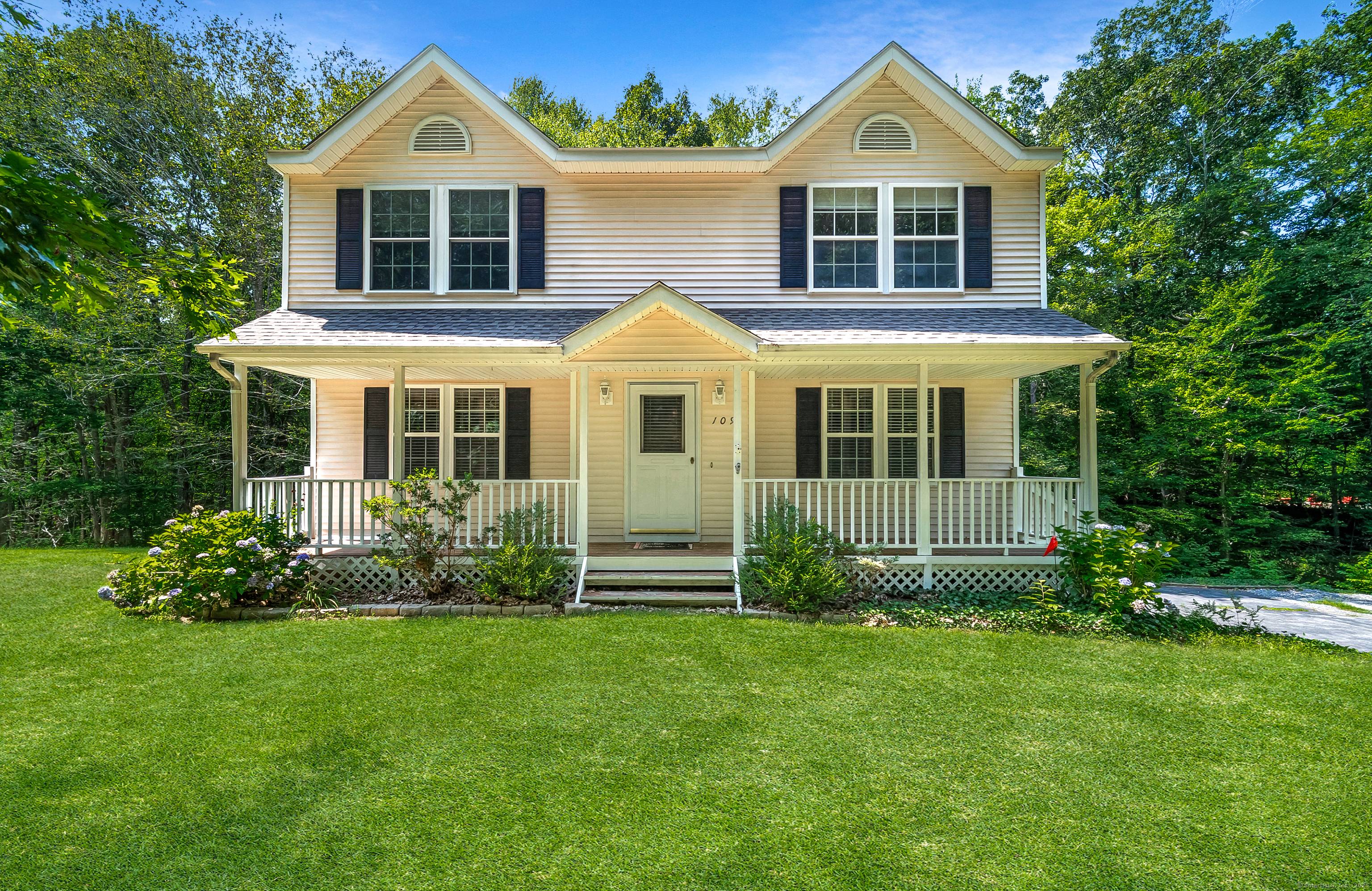 This beautifully maintained colonial farmhouse sits on a generous parcel of land, offering features such as hardwood flooring, a bright family area, and classic styling.