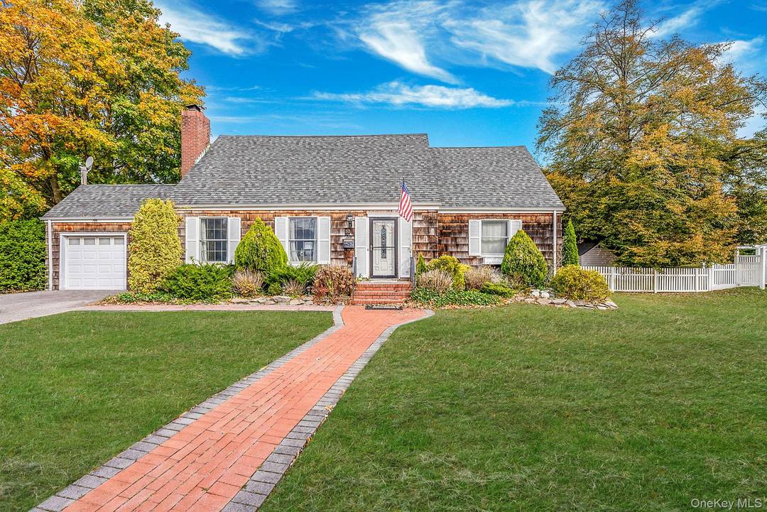 Welcome to this beautifully updated 4 bedroom, 2 bath home tucked away on a tree lined street south of Montauk Highway.