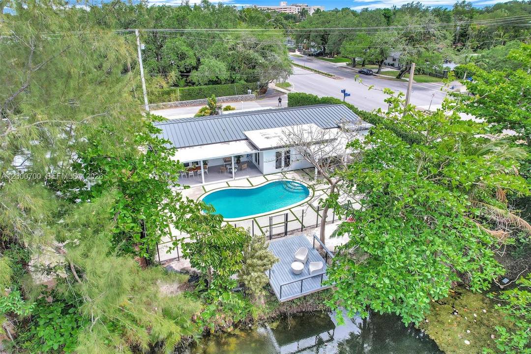 Experience luxury living at its finest in this exceptional South Miami 4 bedroom, 4 bath residence, offering the ambiance of a private beach house in the heart of the city.