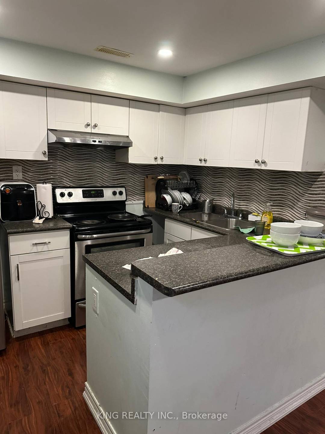 Legal 2 bedroom, 1 bathroom basement with separate entrance, finished with hardwood and tile flooring.