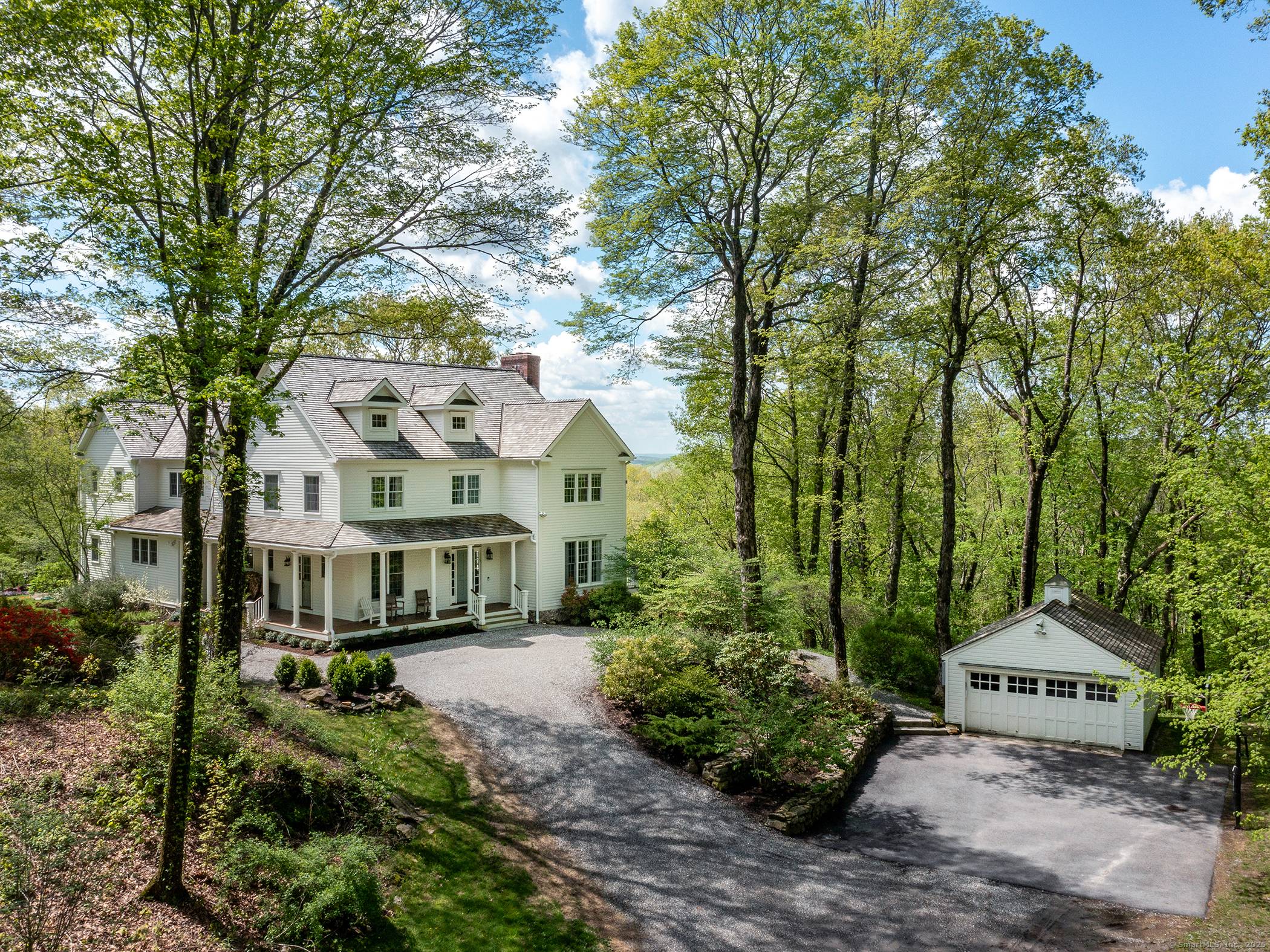 Located along one of Roxbury's most coveted stretches, this property is nestled among an 800 acre greenbelt of farmland and conserved land with plentiful hiking trails.