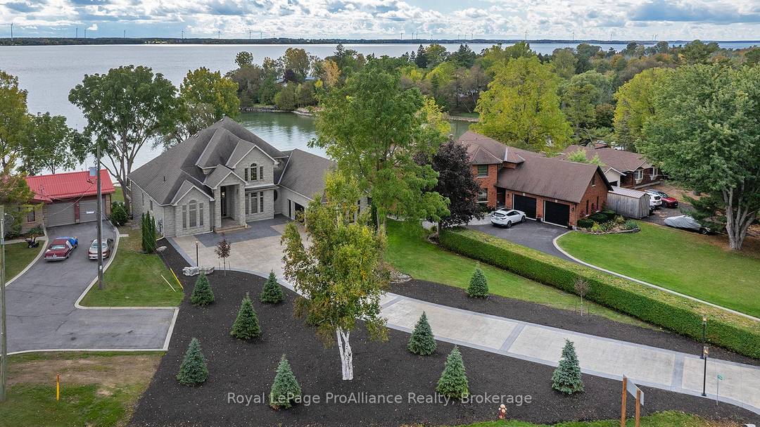 Experience luxury waterfront living with this breathtaking home on Lake Ontario.