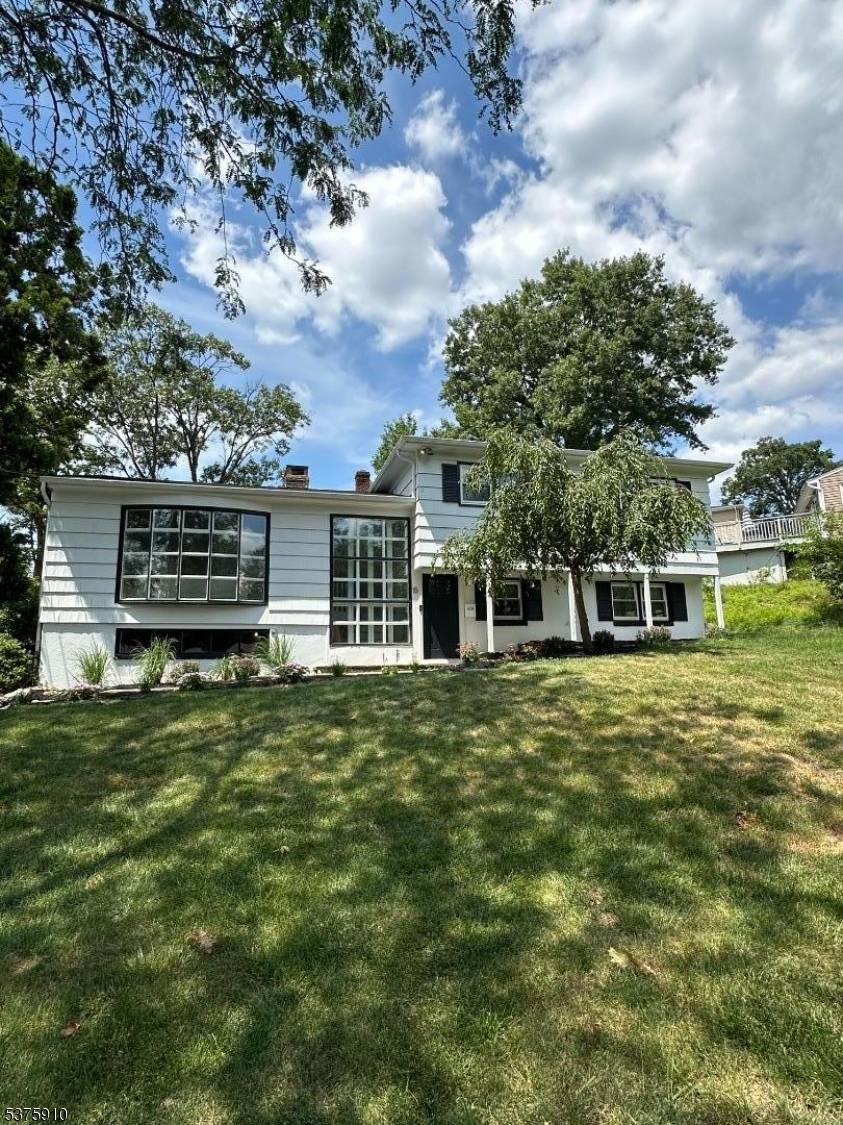 Nestled on a quiet street just minutes from shopping, business centers, and direct access to NYC, this beautifully renovated home offers the perfect blend of style, space, and convenience.