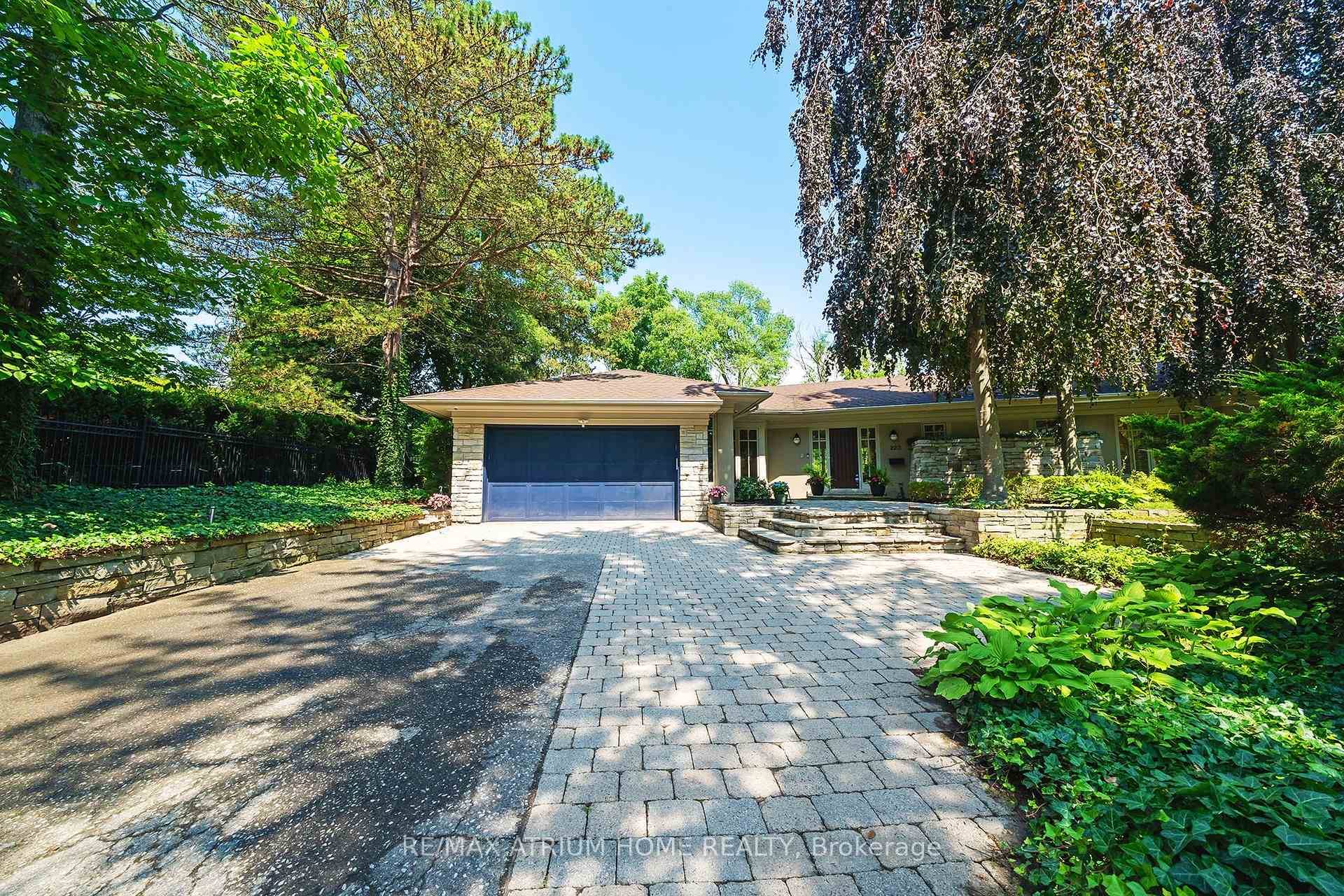 Architect designed executive bungalow by Gren Weis, nestled in prestigious Eastlake on a mature, elevated lot with exceptional drainage and privacy.