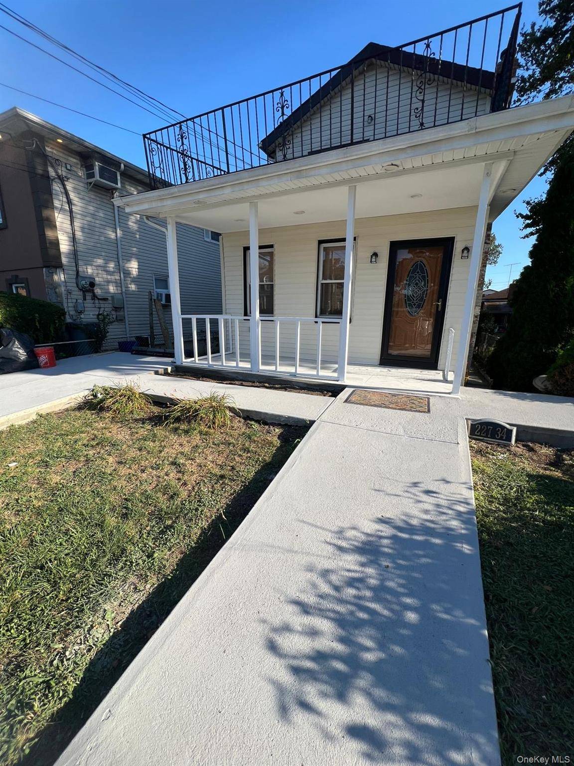 Welcome to 227 34 112th Road, a beautifully renovated single family home offering 5 spacious bedrooms and 2.
