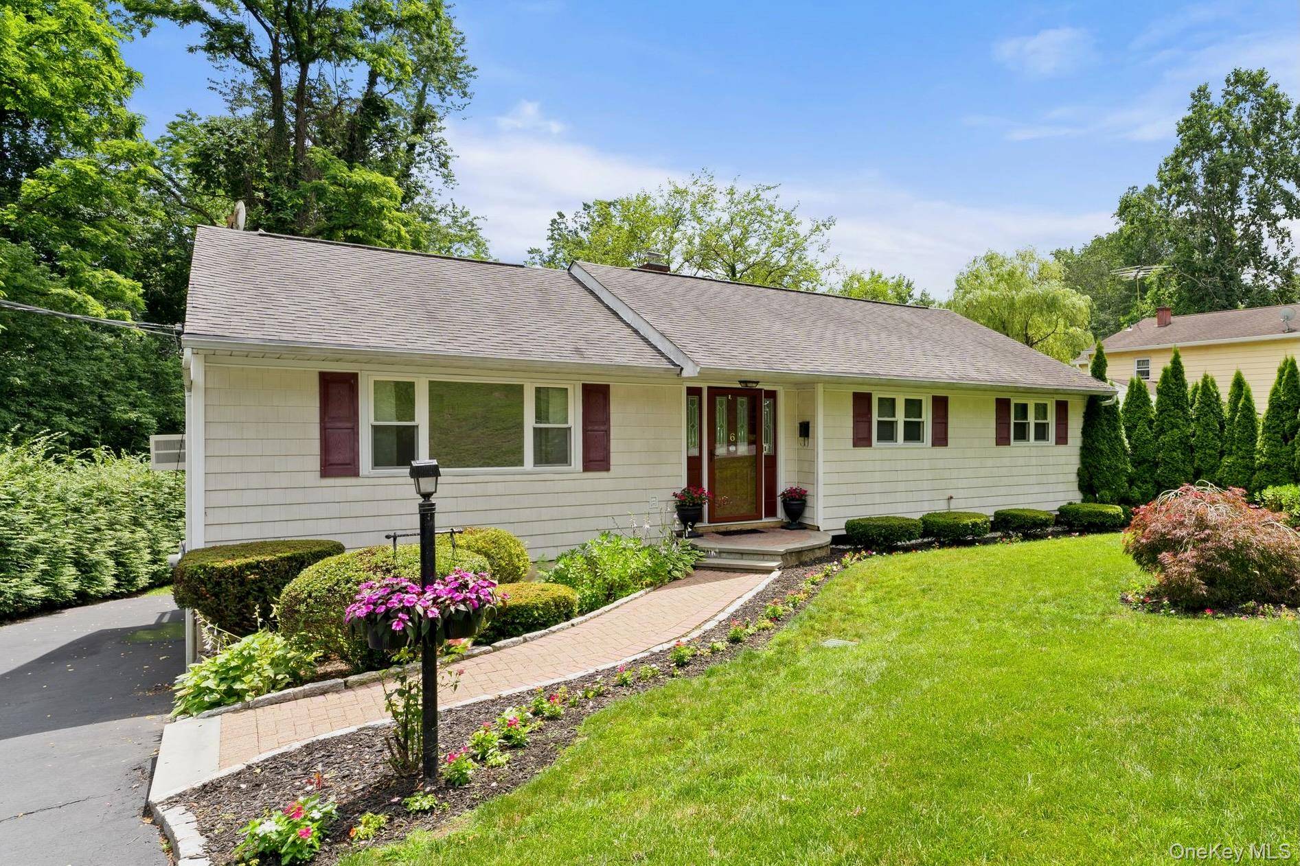 Welcome home to 6 Andover Road with great curb appeal and an oversized level lot.