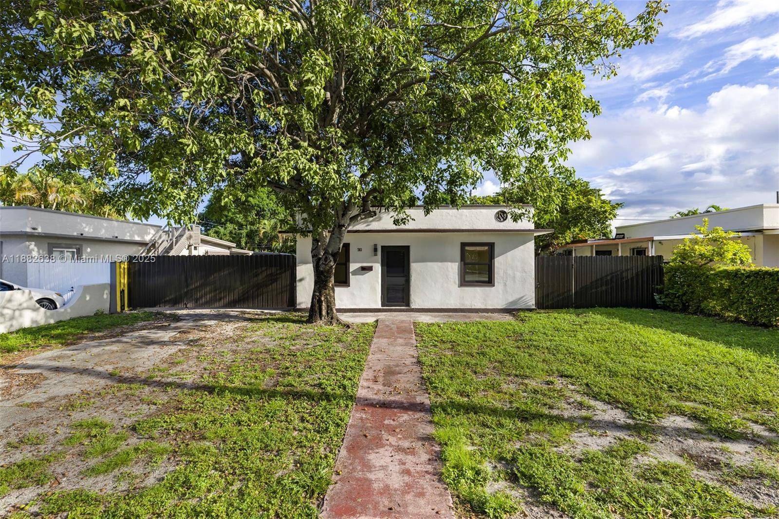 Stylish Home with Miami Views Built with solid concrete walls and roof, this residence features a brand new kitchen and modern bathroom, combining durability with fresh design.