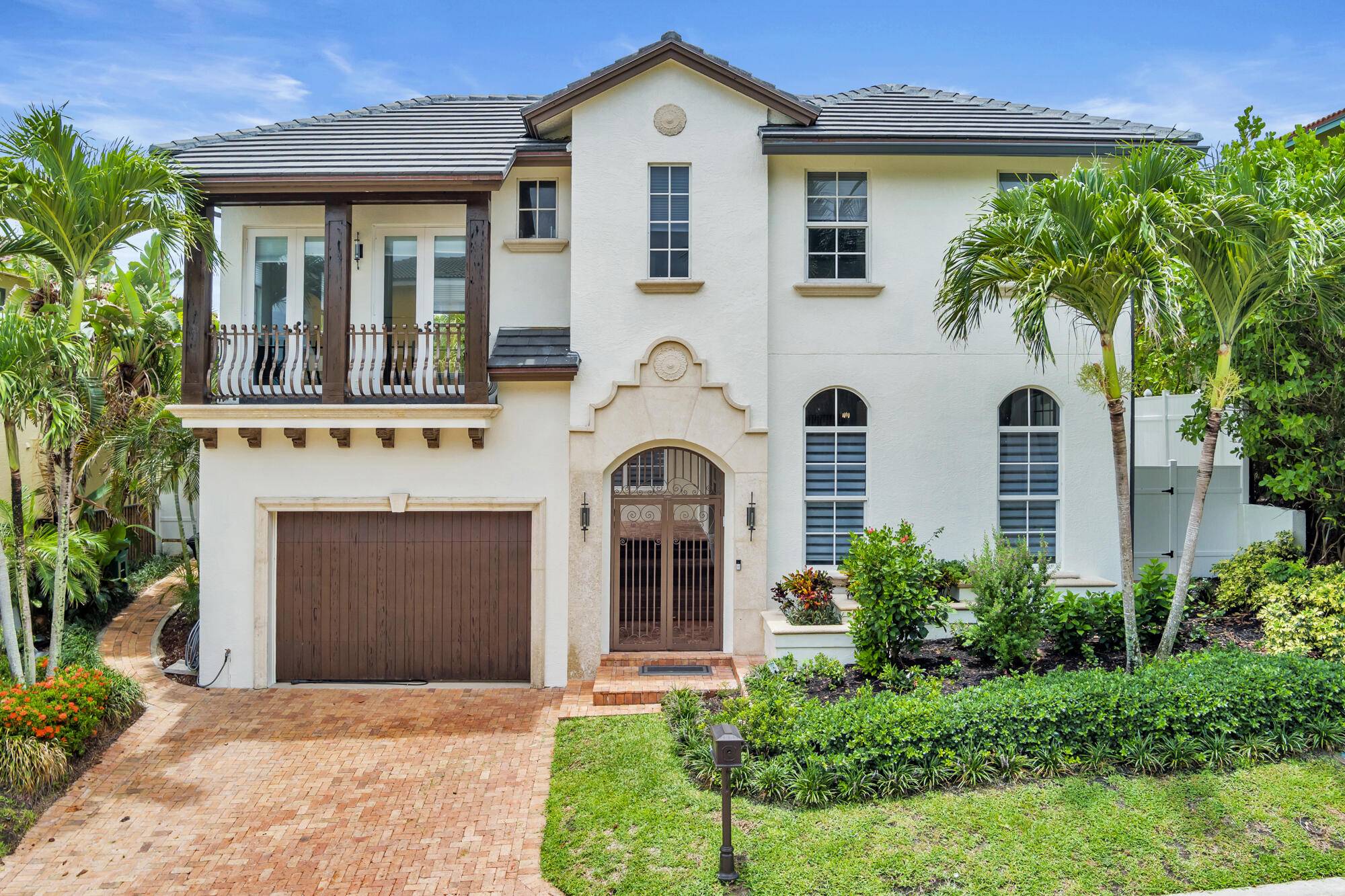 LIVE STEPS FROM THE BEACH in this EXTENSIVELY RENOVATED Mediterranean style home in JUNO BEACH !