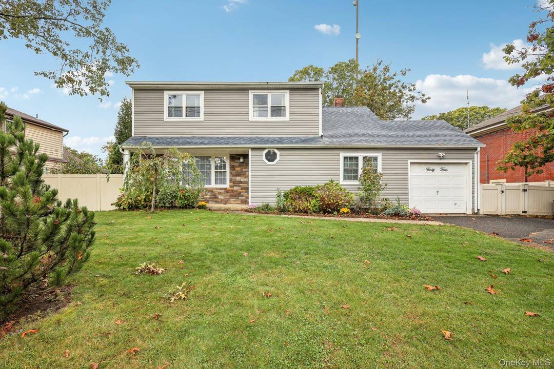Located in the highly desired Smithtown school district, this well built builder s colonial offers modern updates and timeless charm.