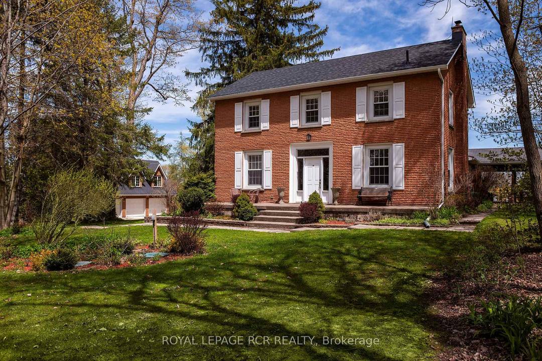 A maple tree lined driveway welcomes you to a 65 acre park setting in the rolling hills of Mulmur.