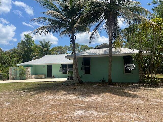 Spacious 2076 sq ft home in Jupiter Farms PLUS a huge detached garage building in back yard 1400 sq ft !