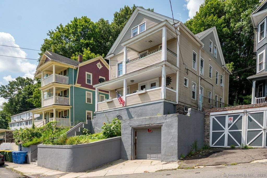 Investors Take Notice of this Income Producing Three Family Home in Waterbury that is Fully Rented.