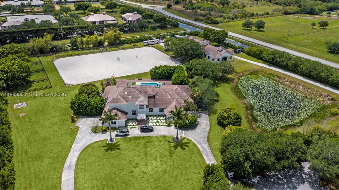 Breathtaking contemporary estate in Palm Beach Point set on over 7 acres of prime equestrian land.