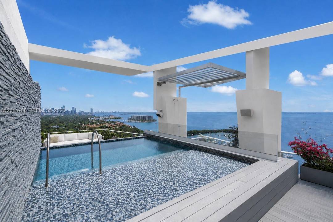 Positioned high above Coconut Grove, this remarkable 11, 810 SF penthouse at Grovenor House defines contemporary waterfront living.