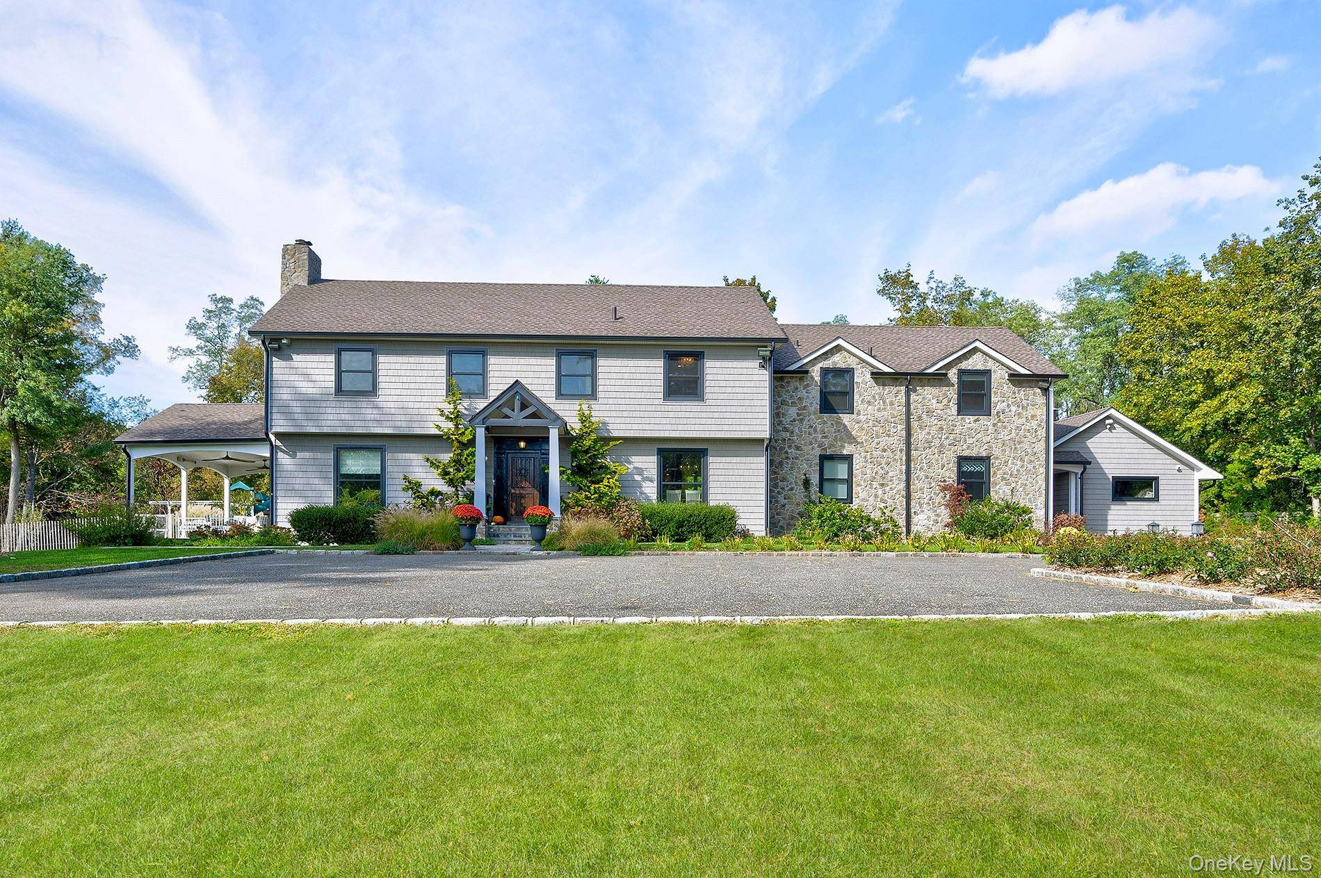 This elegant 4 bedroom home with a 5th bedroom in the finished lower level, Hillwinds, set on 3.