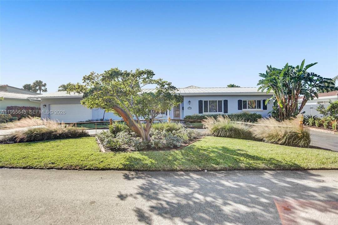 Move in ready and beautifully remodeled, this stunning Lighthouse Point home features a brand new flat roof, 6 spacious bedrooms, and 4 modern bathrooms.