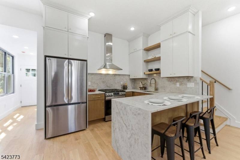 Welcome to 113 Oak Street, a truly one of a kind two family residence in the heart of Bergen Lafayette offering a rare blend of space, design, and income potential ...