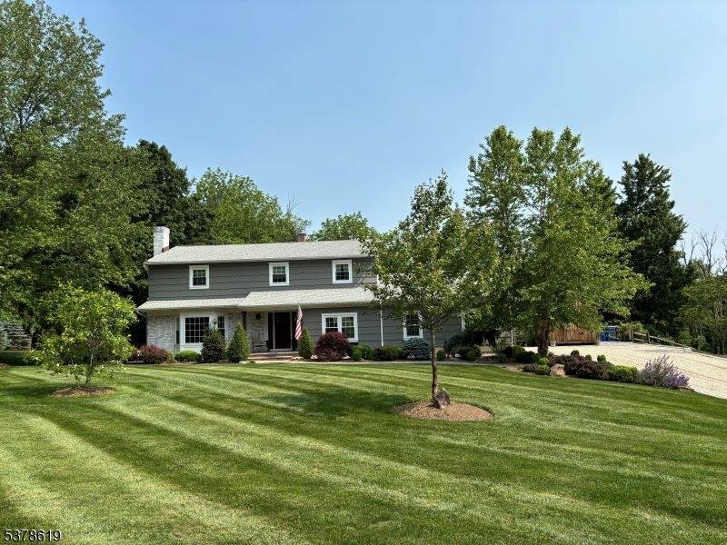 Backing to private woodlands, Classic 5 BR, 3 BA Colonial on 1.