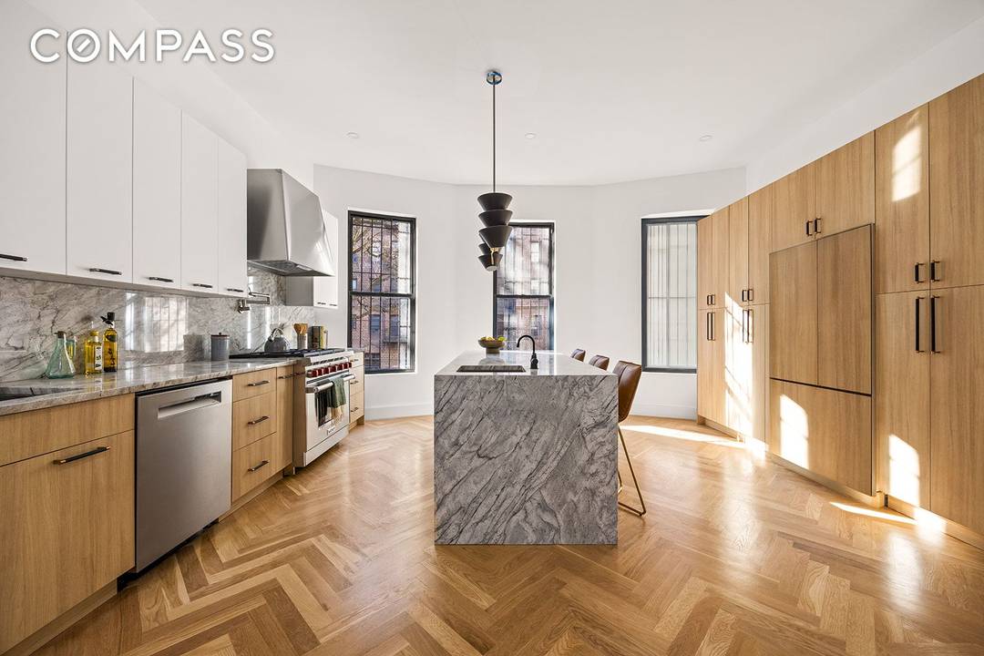 Stunning Renovated Two Family Riverside Drive Brownstone Welcome to this exquisite 12 room townhouse located on the prestigious Riverside Drive in Manhattan.