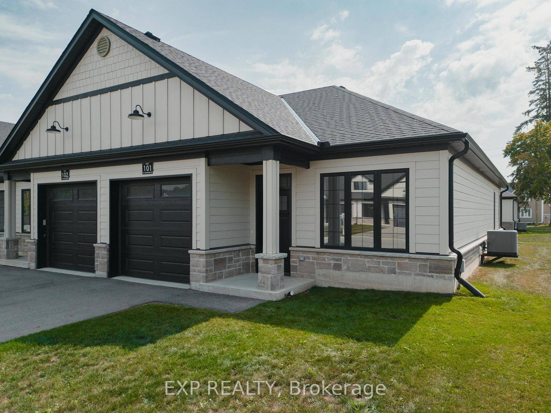 Welcome to 12 Washington St, Unit 101 a beautifully staged end unit bungalow townhouse offering the perfect blend of style, comfort, and convenience in the heart of Norwich.
