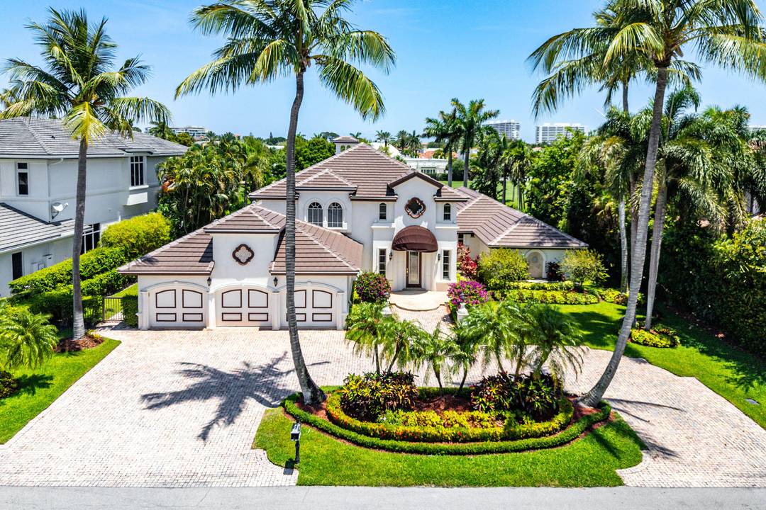Welcome to 1330 Sabal Palm Drive, perfectly positioned on the Royal Palm Yacht Country Club's acclaimed golf course.
