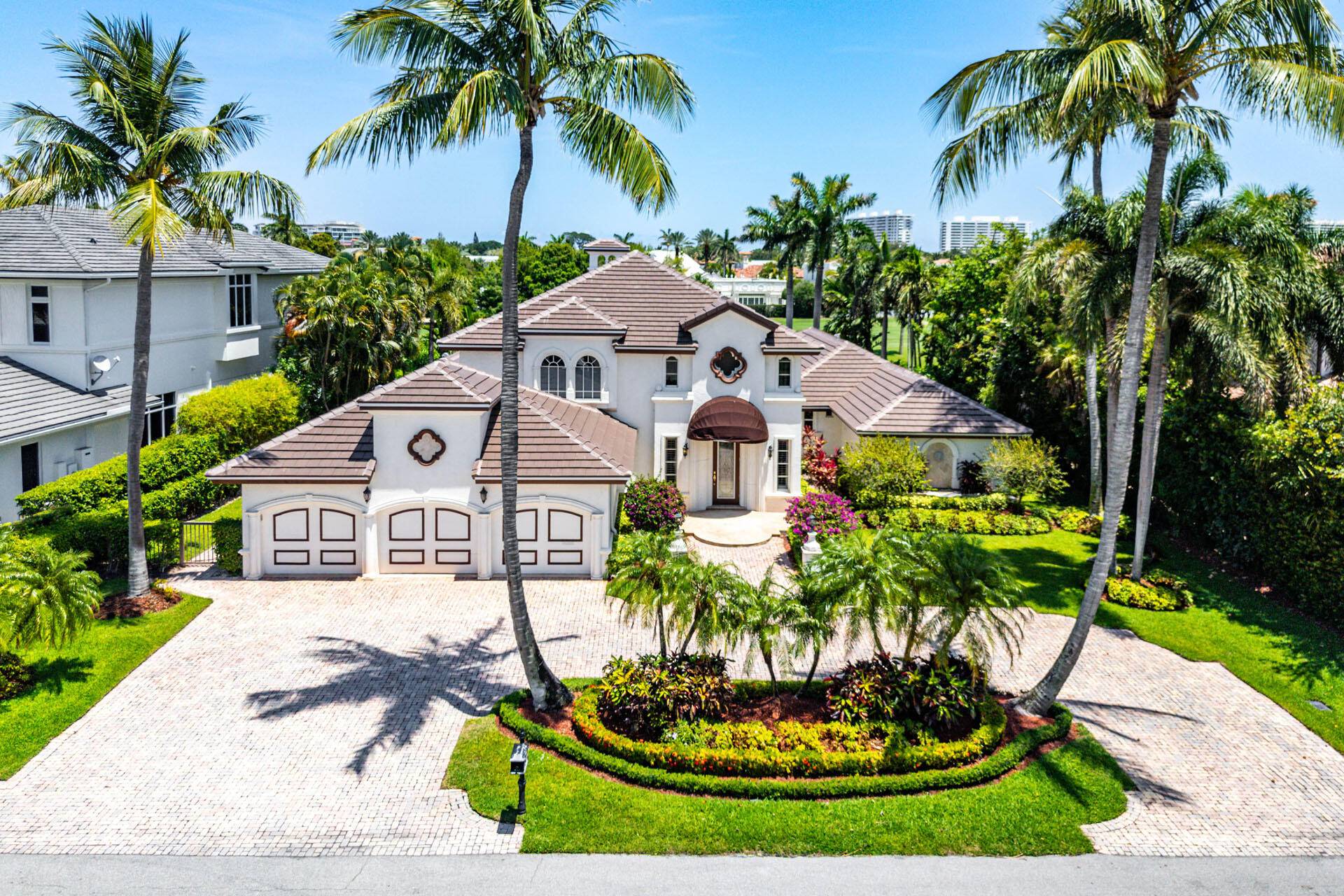 Welcome to 1330 Sabal Palm Drive, an exceptional contemporary estate that blends modern luxury with timeless elegance, perfectly positioned on the Royal Palm Yacht Country Club's acclaimed golf course.
