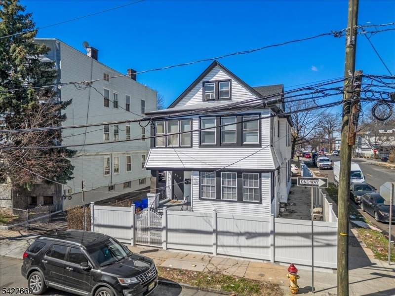 Fully Renovated 2 family with Bonus Living Space Ample Parking !