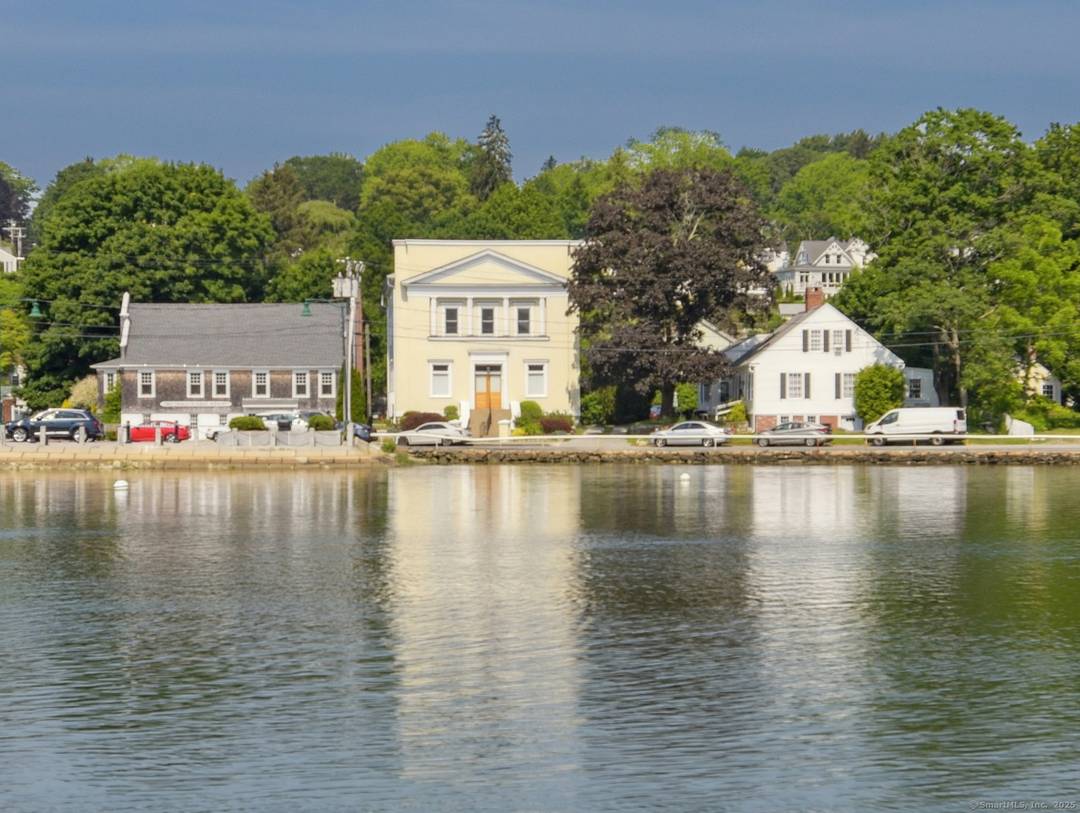 Discover unparalleled one level living in this stunning 2, 338 square foot condominium in Historic Downtown Mystic, Connecticut across from the Mystic River and Bascule Bridge.