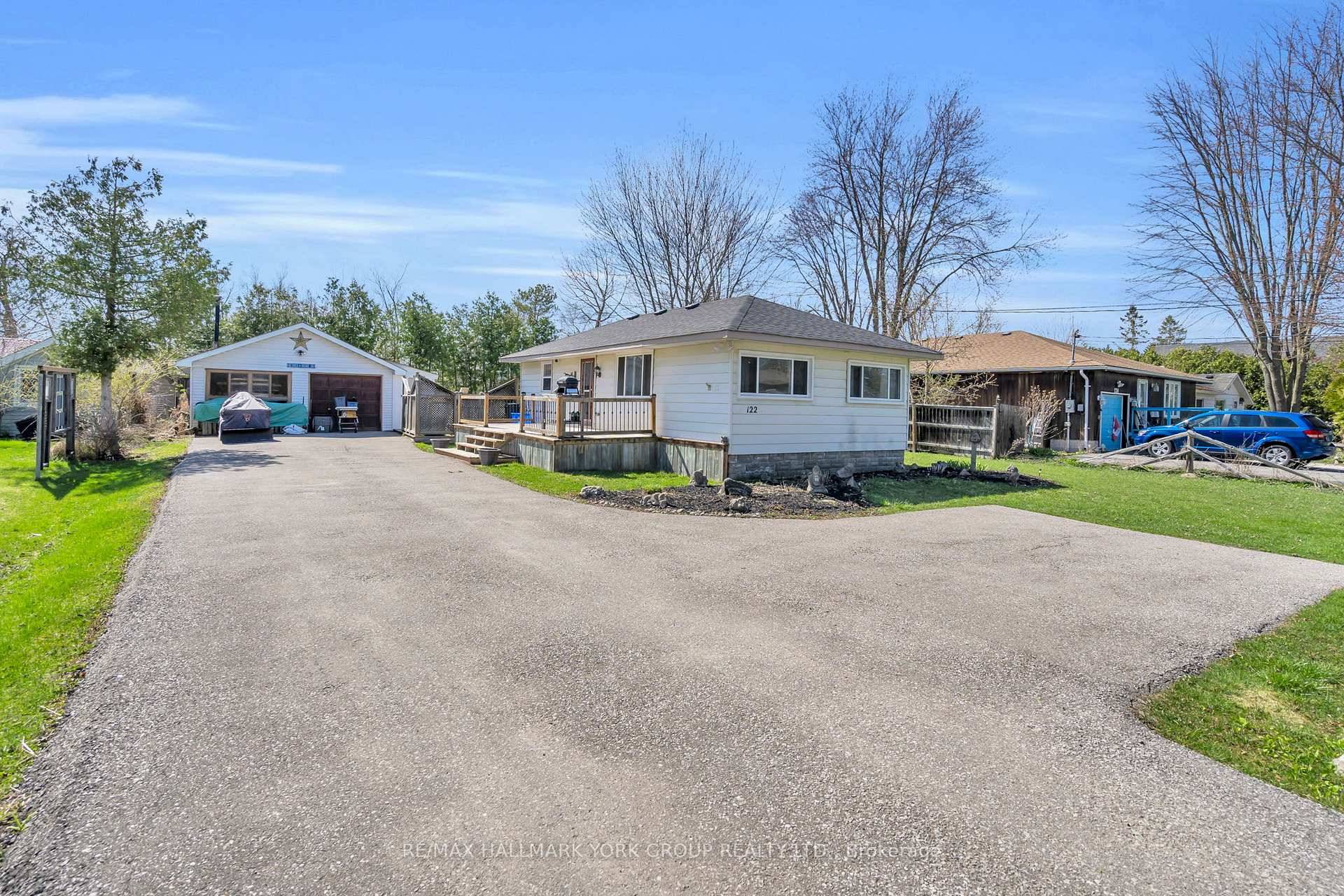 Situated in the Lakeside Community of Virginia, This Charming Year round Bungalow at 122 Sunset Beach Road Offers Peaceful Living Just Steps From Lake Simcoe.