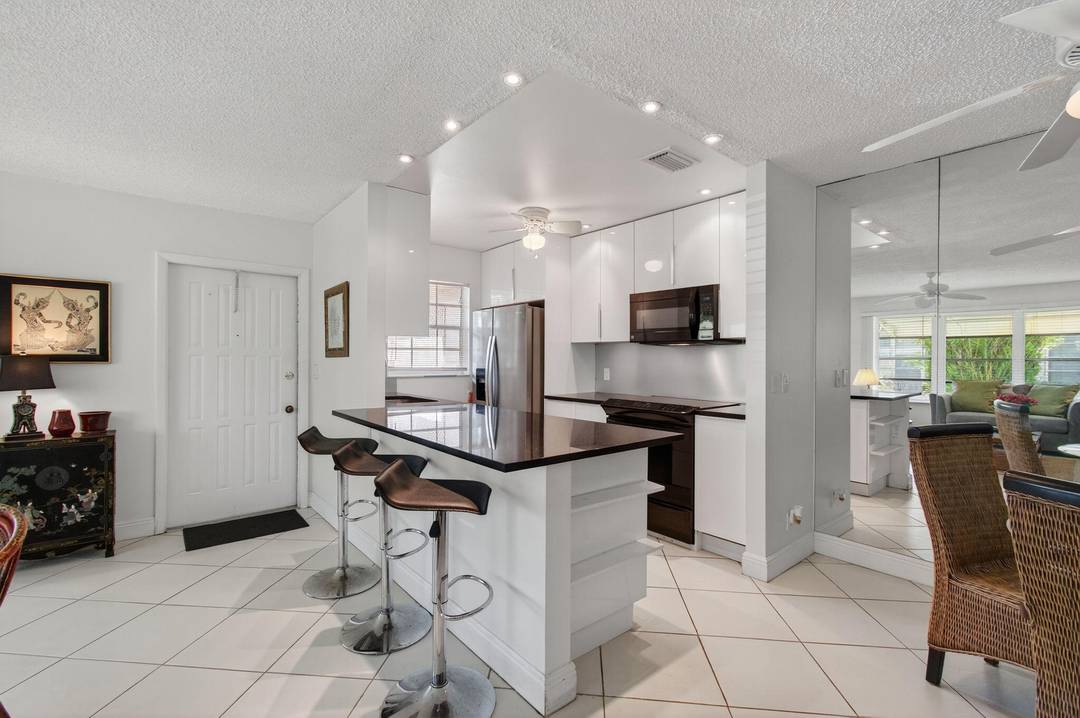 Pride of ownership is evident from the moment you step into this remodeled and well maintained bright, airy and spacious 2BR 2BA corner villa.