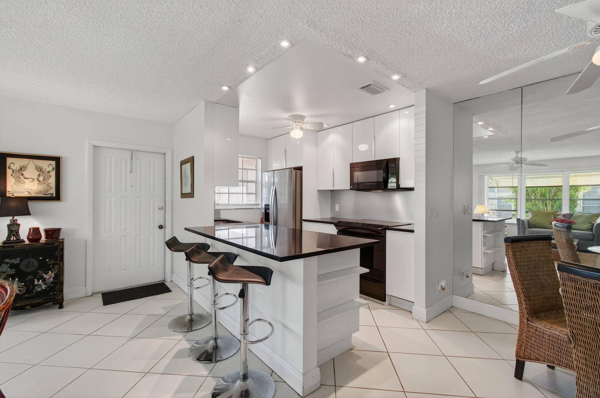 Pride of ownership is evident from the moment you step into this remodeled and well maintained bright, airy and spacious 2BR 2BA corner villa.