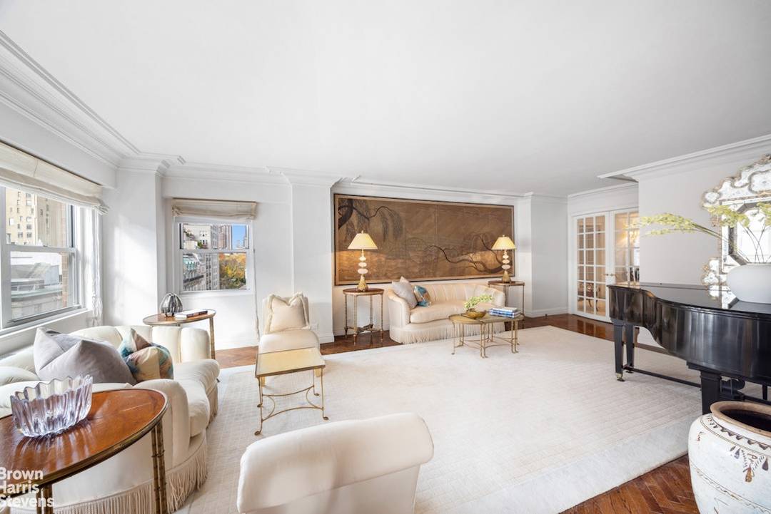 JUST LISTED ! A grand and sundrenched corner 6 room home on a high floor in a full service luxury cooperative just one block from Central Park.
