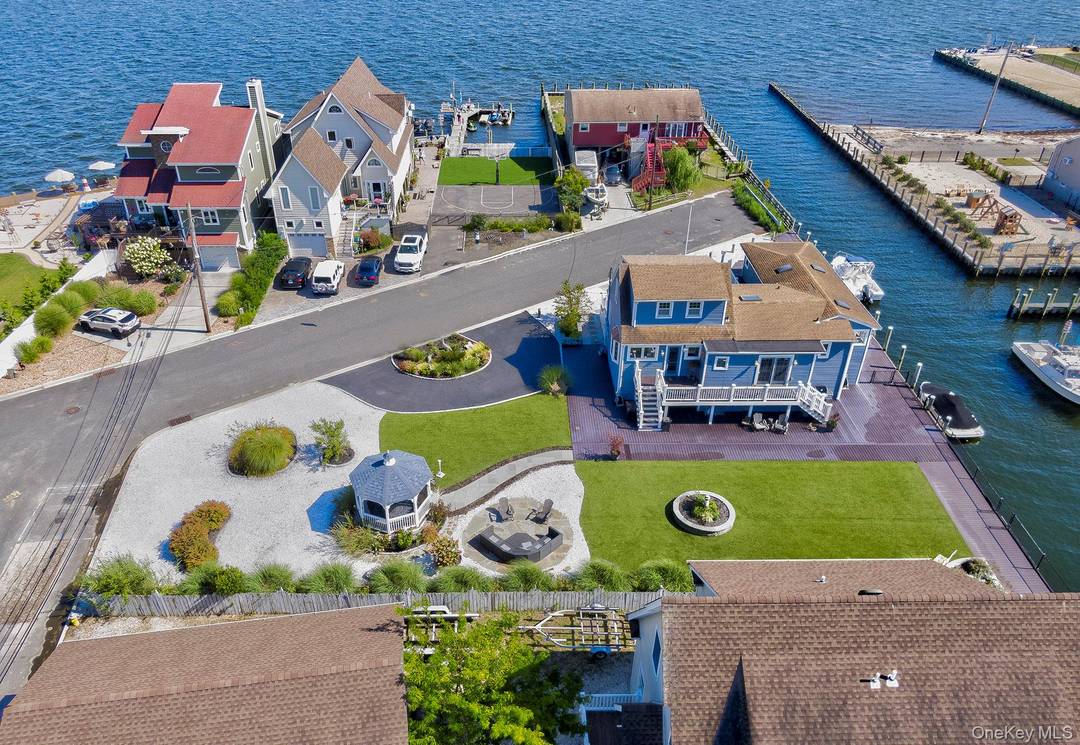 LEGAL 2 FAMILY ! Experience resort style waterfront living in this beautifully updated legal 2 family home by CO with a separate 1 bedroom apartment, ideally located in a cul ...